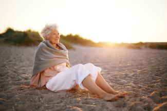 Senior woman relaxing on a beach