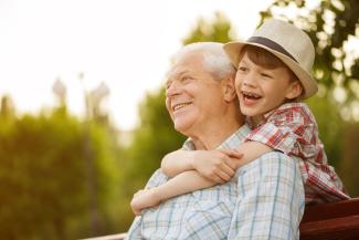 Grandfather and grandson looking happy
